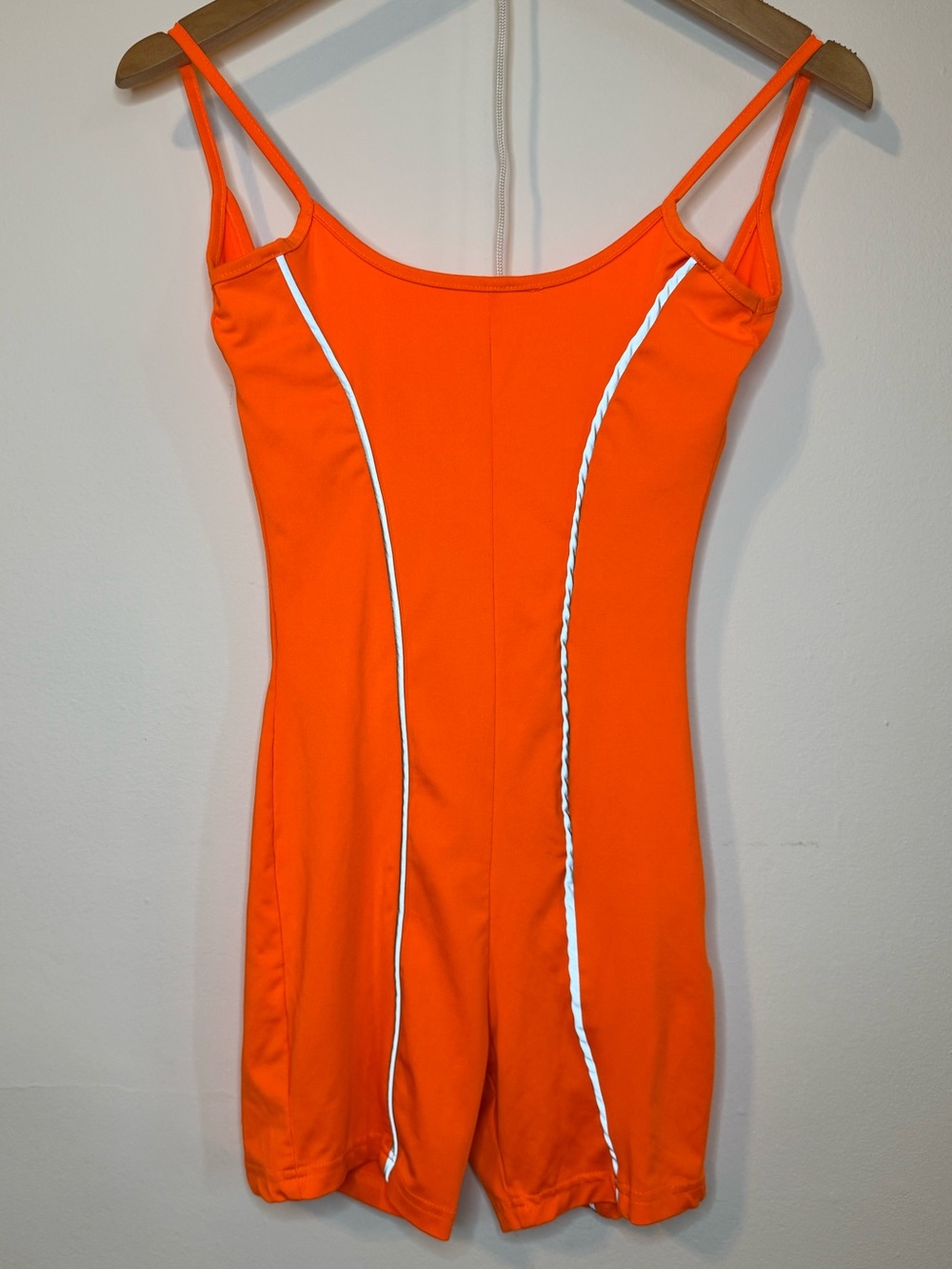 Orange one piece romper with reflective detail